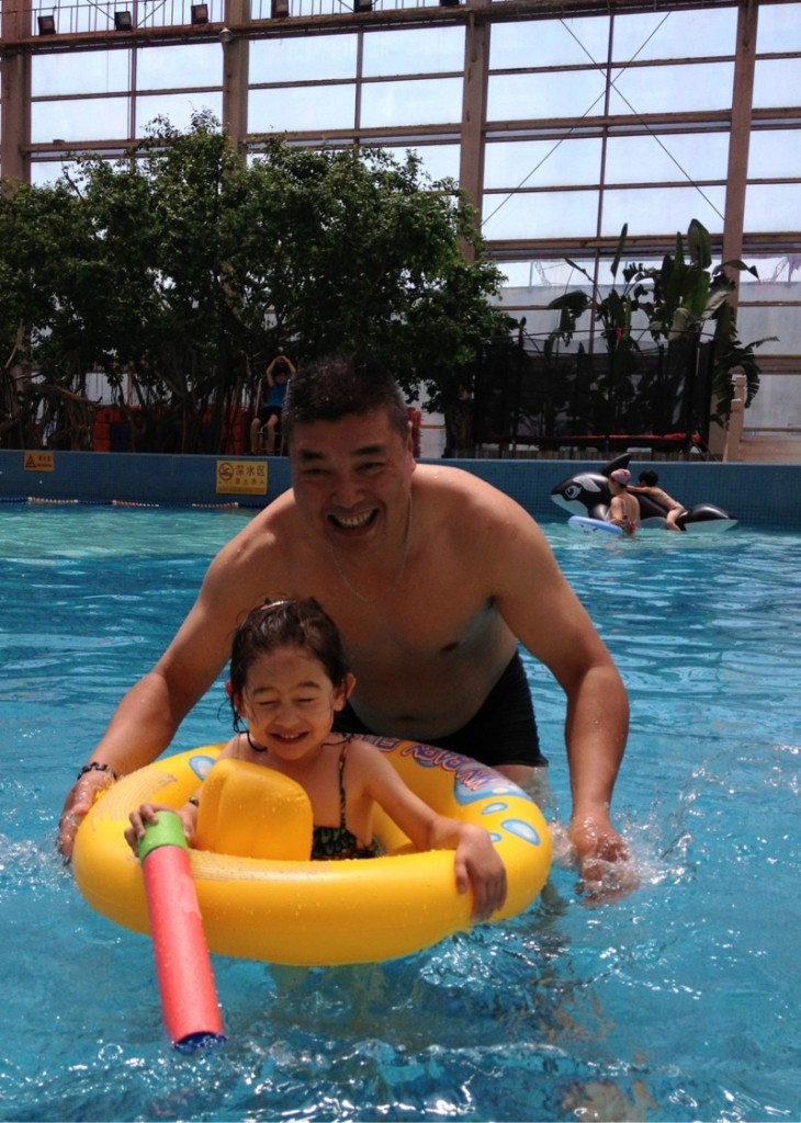 Ammie in pool with Uncle
